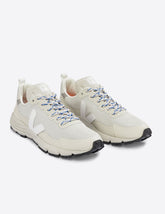 white VEJA sneakers for outdoor activities.